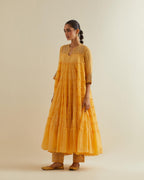 Yellow cotton chanderi multi-tiered kurta dress set with 3/4 sleeves, highlighted with mirror work.