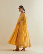 Yellow cotton chanderi multi-tiered kurta dress set with 3/4 sleeves, highlighted with mirror work.