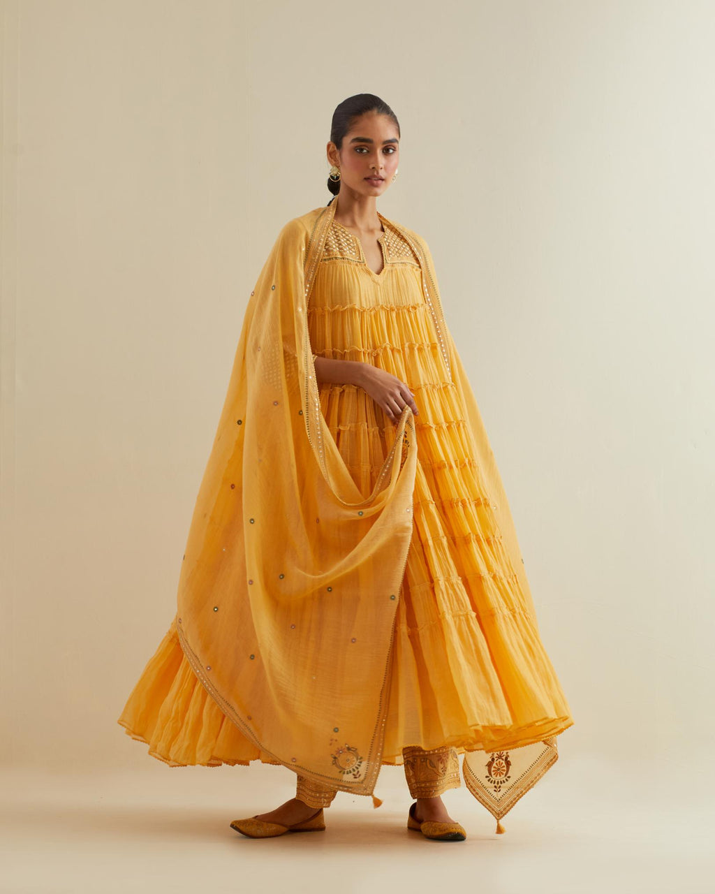 Yellow cotton chanderi dupatta with delicate silk thread embroidery, highlighted with braids, mirrors and sequins work.