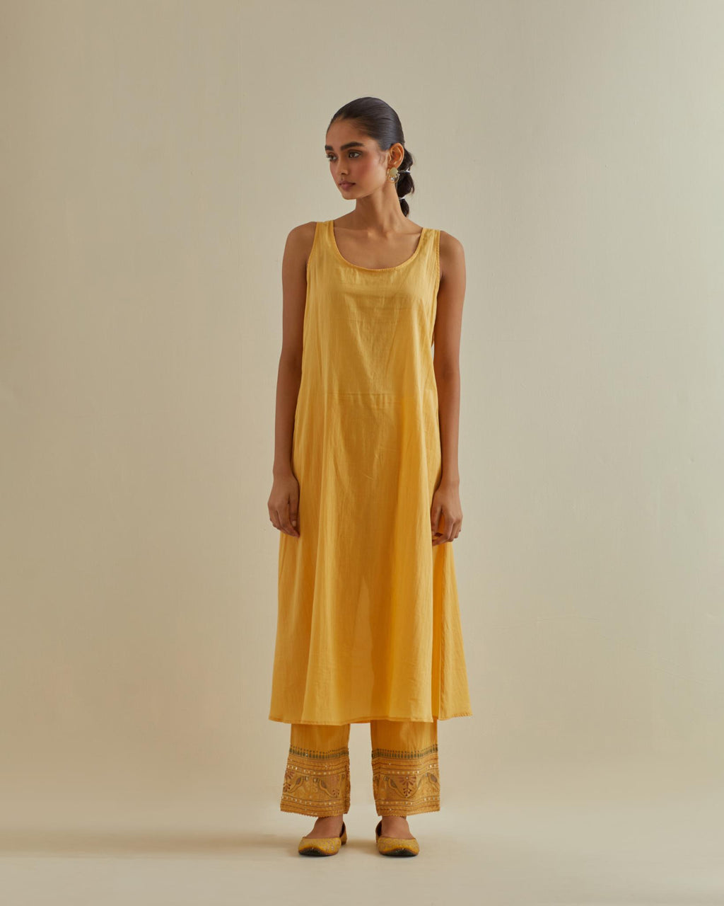 Yellow cotton chanderi kurta dress set with a V neck embroidered yoke and panels.