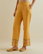 Yellow straight pants with all over multi color embroidery detailed with sequins.
