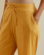 Yellow straight pants with all over multi color embroidery detailed with sequins.