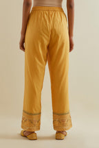 Yellow straight pants with all over multi color embroidery detailed with sequins.