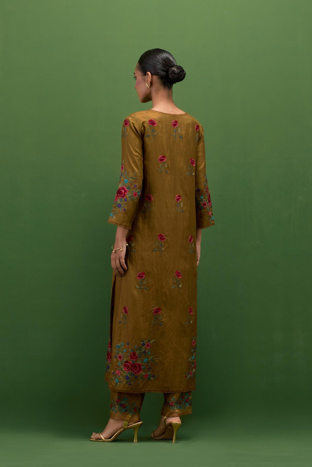 Golden olive silk straight kurta set with all-over roses embroidered in thread and scalloped organza detail at the edges.
