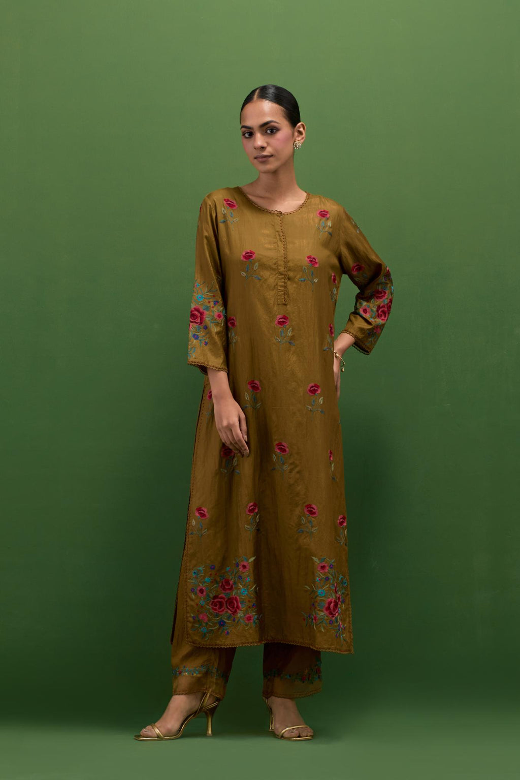 Golden olive silk straight kurta set with all-over roses embroidered in thread and scalloped organza detail at the edges.