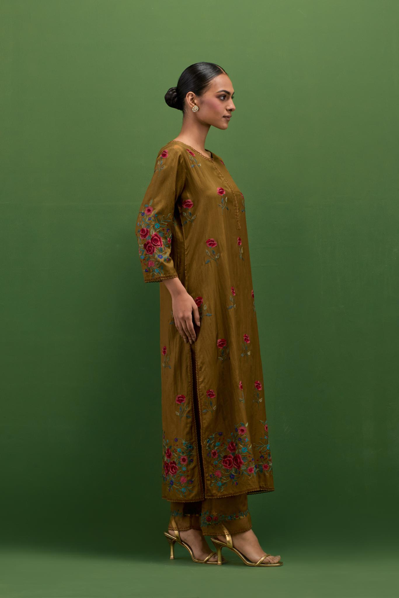 Golden olive silk straight kurta set with all-over roses embroidered in thread and scalloped organza detail at the edges.