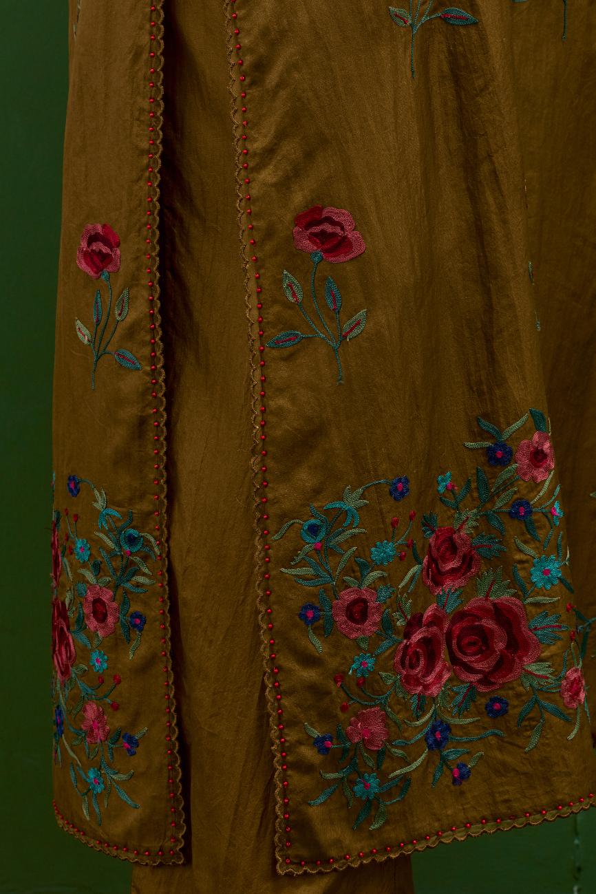 Golden olive silk straight kurta set with all-over roses embroidered in thread and scalloped organza detail at the edges.