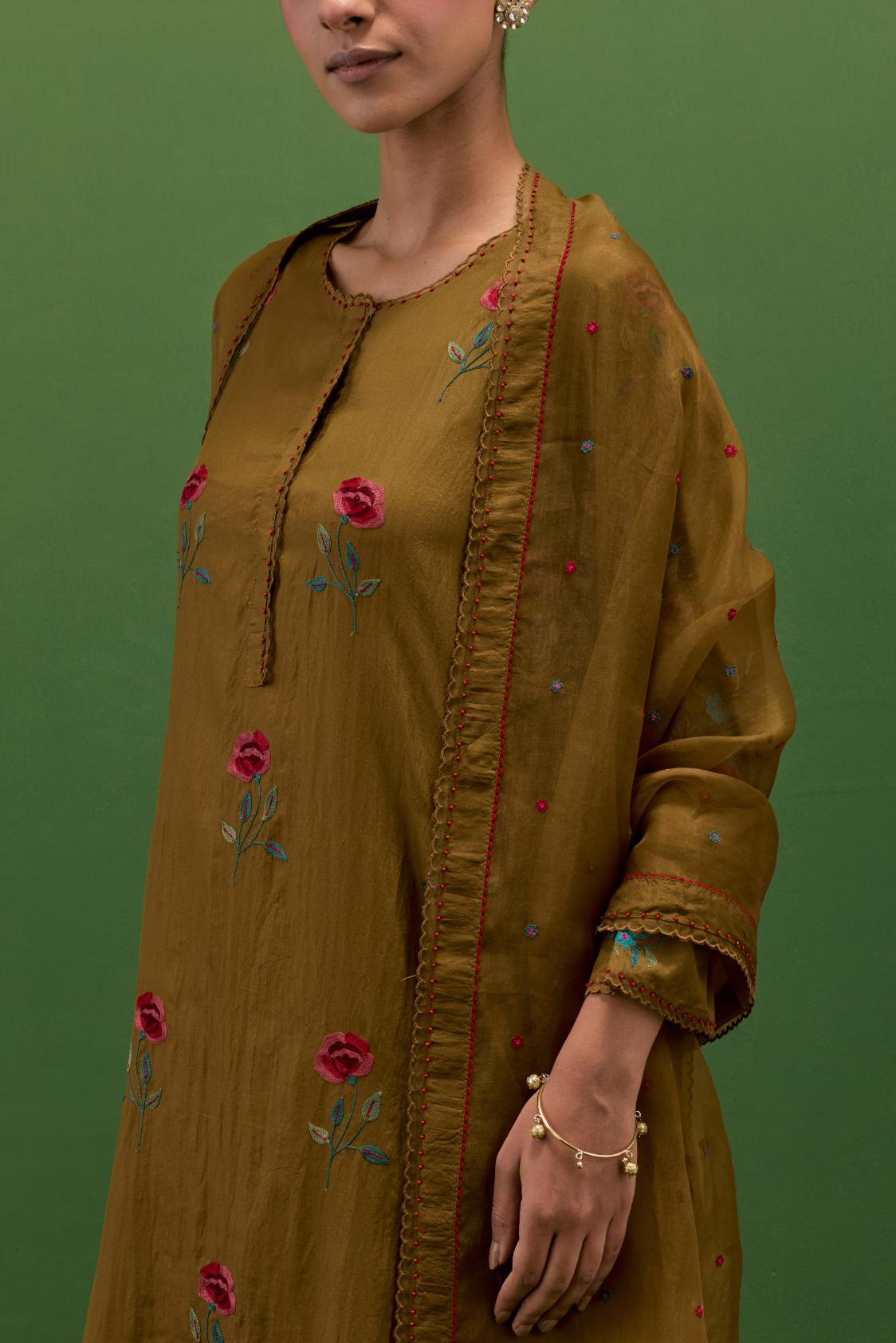 Golden olive silk straight kurta set with all-over roses embroidered in thread and scalloped organza detail at the edges.
