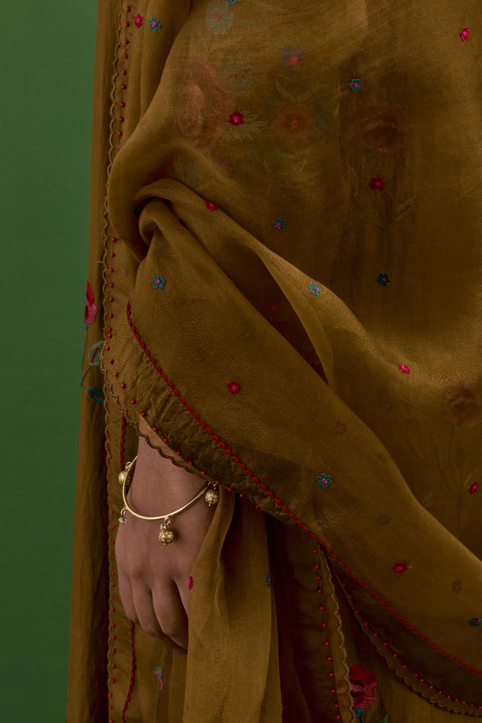 Golden olive silk organza dupatta with a narrow silk border finished with a delicate organza scalloped edge, highlighted with contrast bead work.