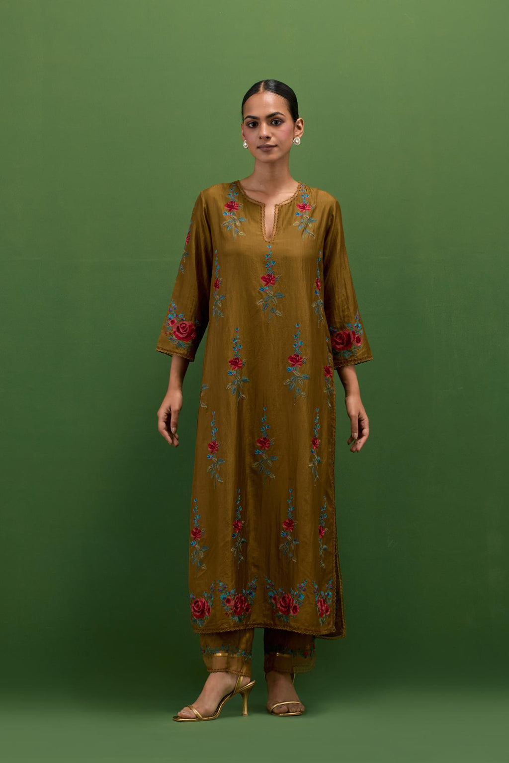 Golden olive silk straight kurta set with all-over rose embroidery and scalloped organza detail at the edges.