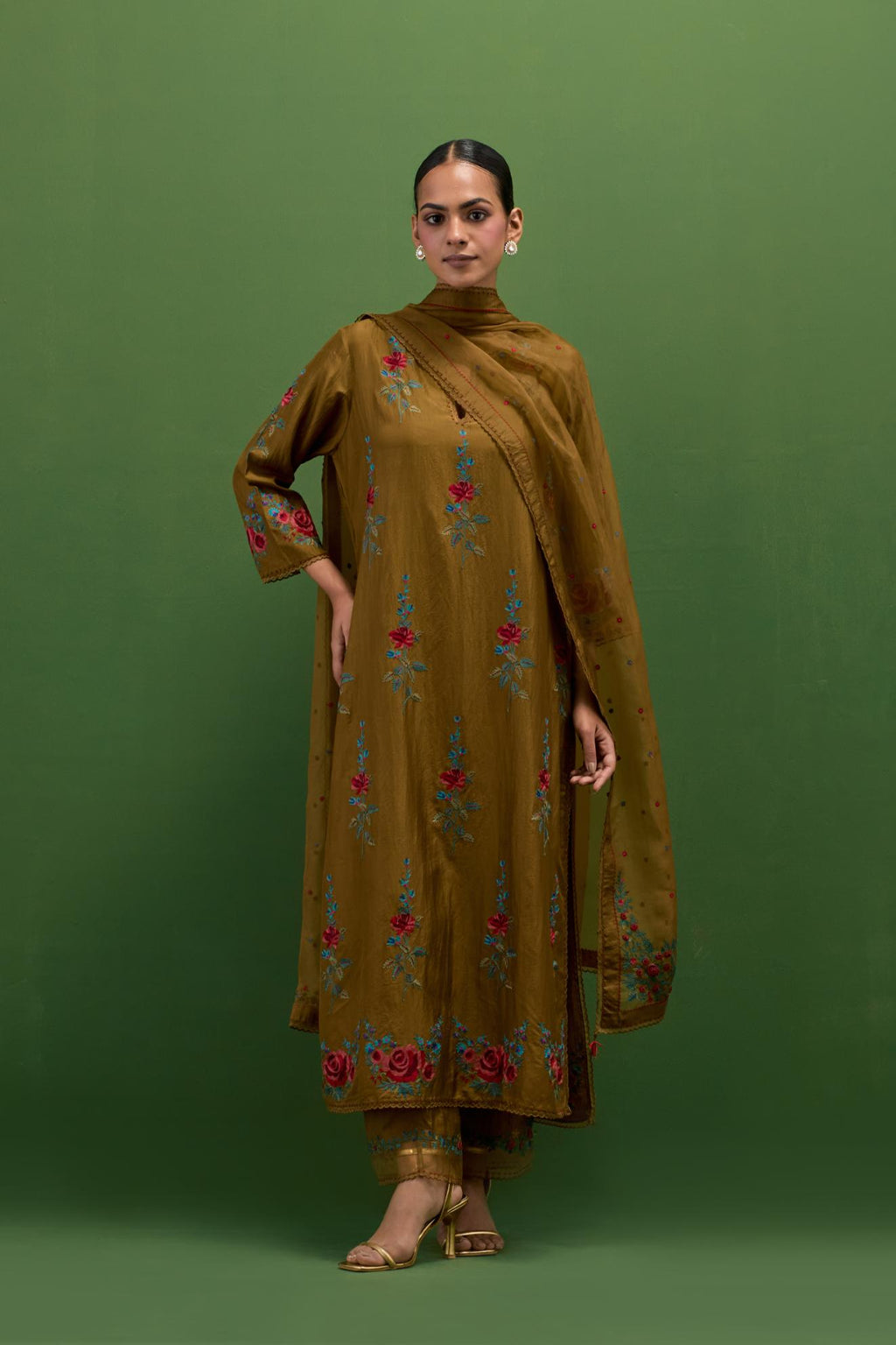 Golden olive silk straight kurta set with all-over rose embroidery and scalloped organza detail at the edges.