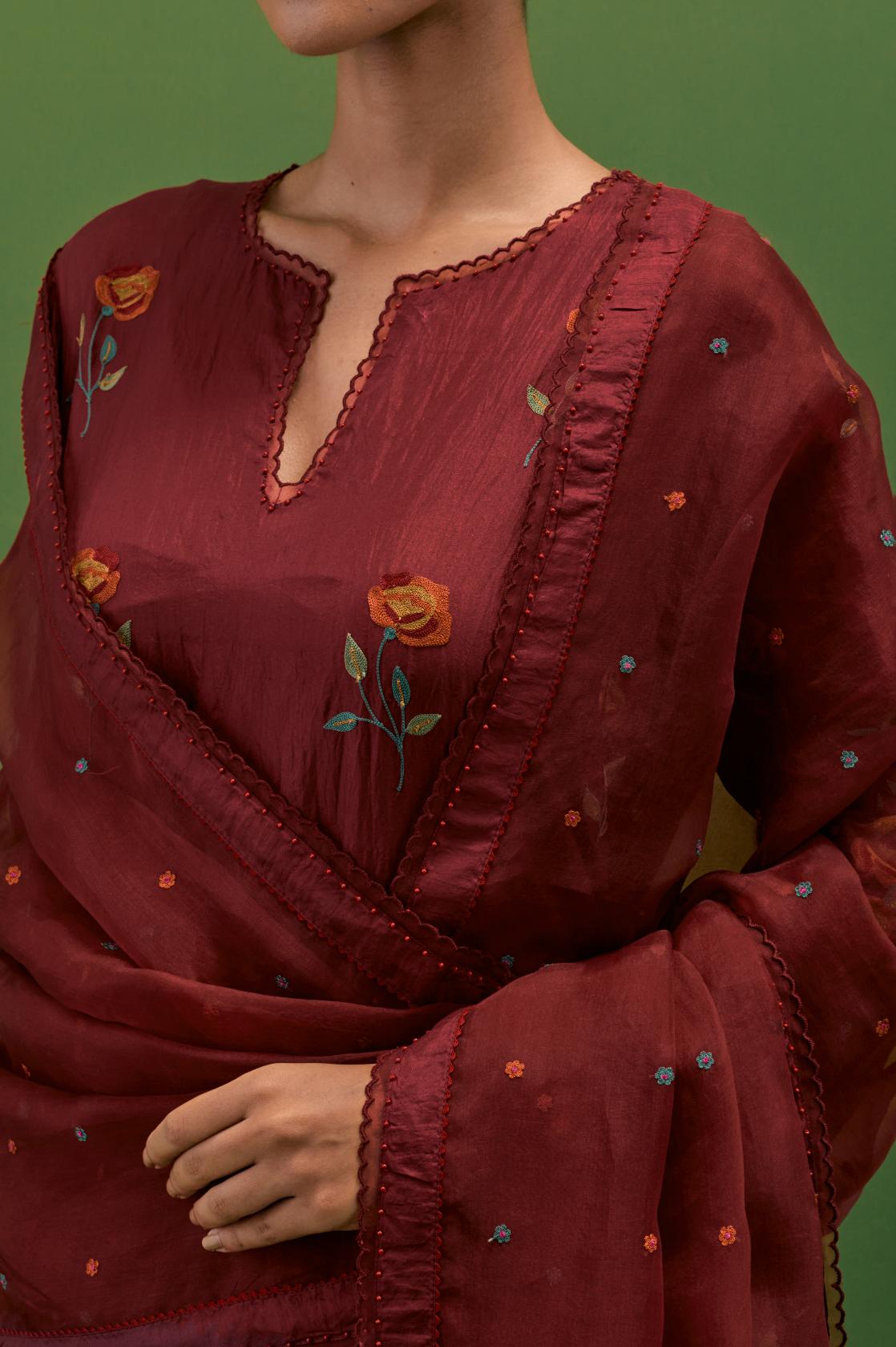 Rosewood silk straight kurta set with all-over roses embroidered in thread and scalloped organza detail at the edges.