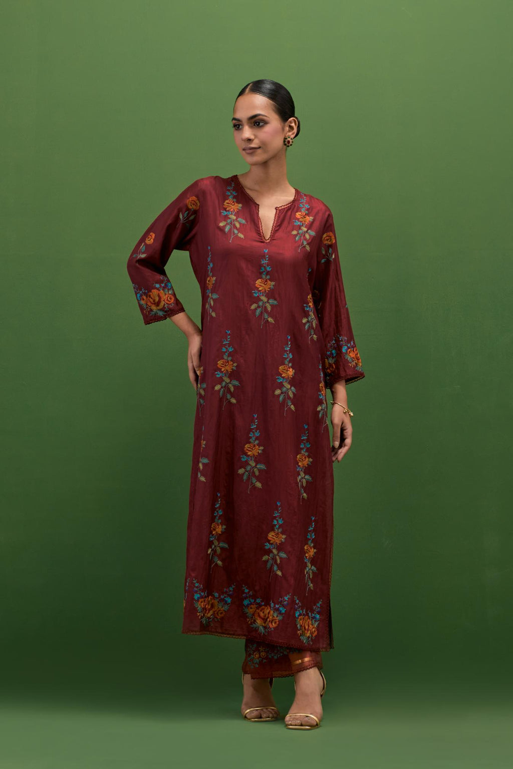 Rosewood silk straight kurta set with all-over rose embroidery and scalloped organza detail at the edges.