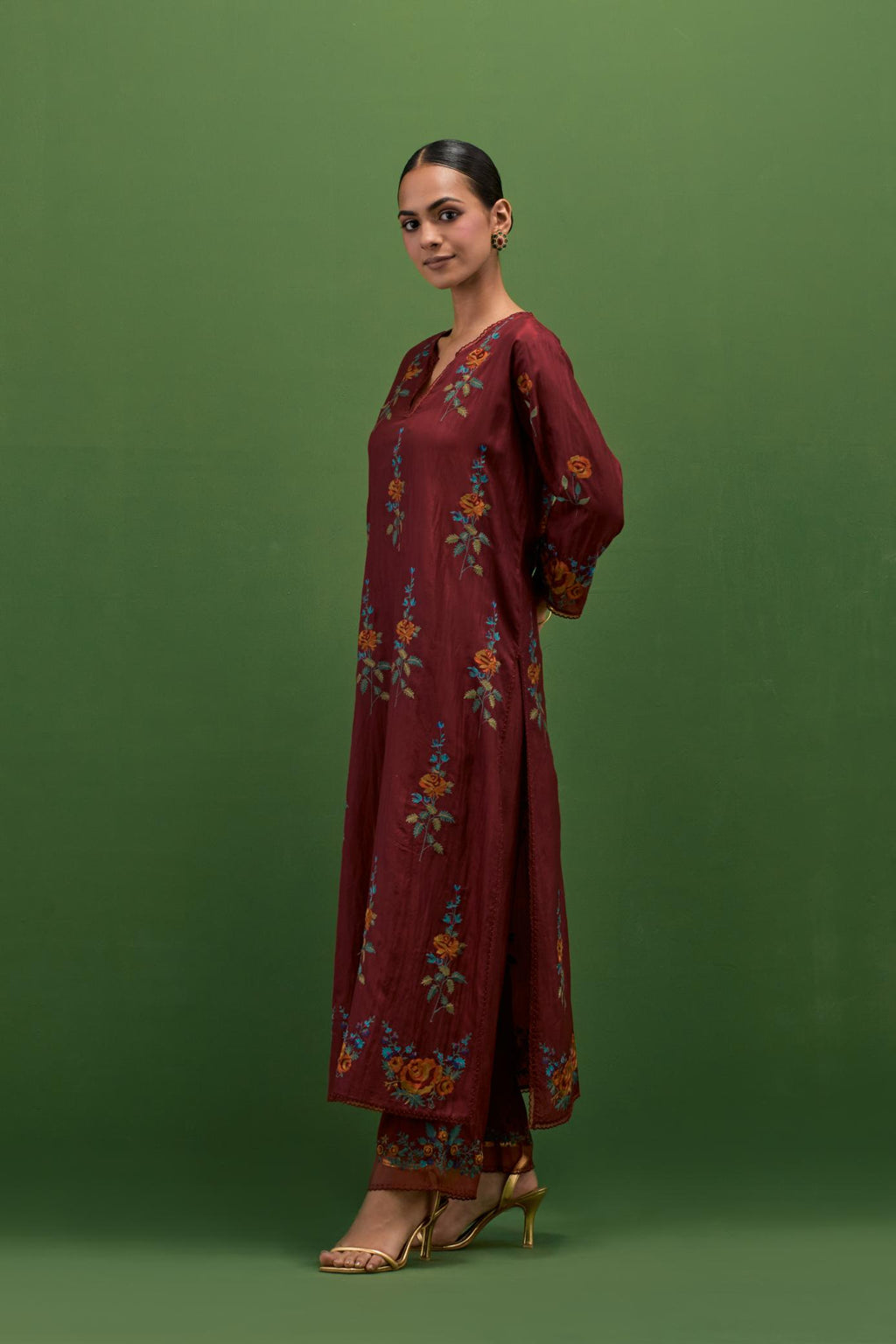 Rosewood silk straight kurta set with all-over rose embroidery and scalloped organza detail at the edges.