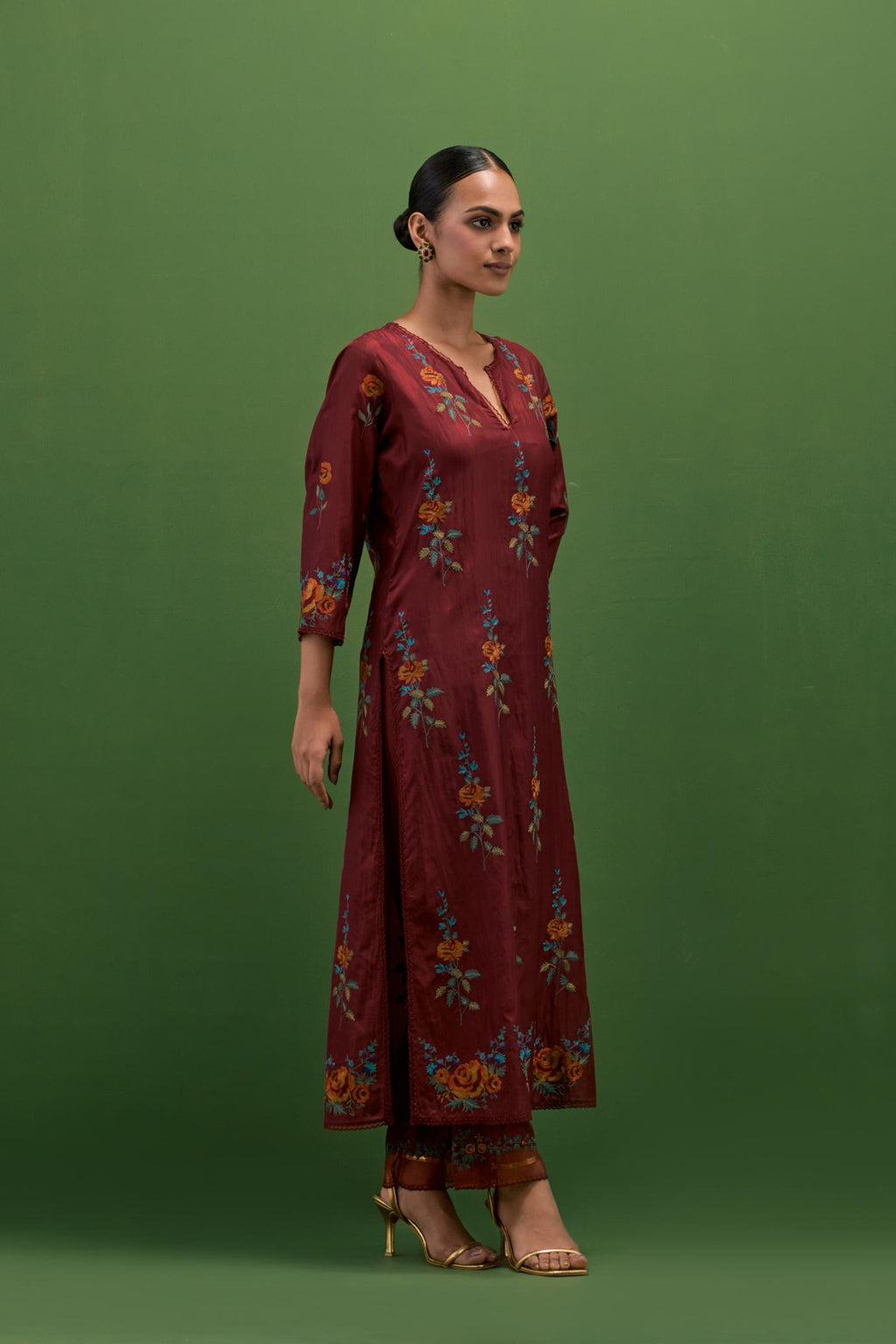 Rosewood silk straight kurta set with all-over rose embroidery and scalloped organza detail at the edges.