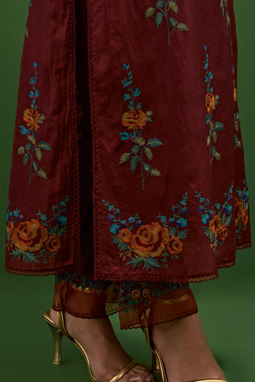 Rosewood silk straight kurta set with all-over rose embroidery and scalloped organza detail at the edges.