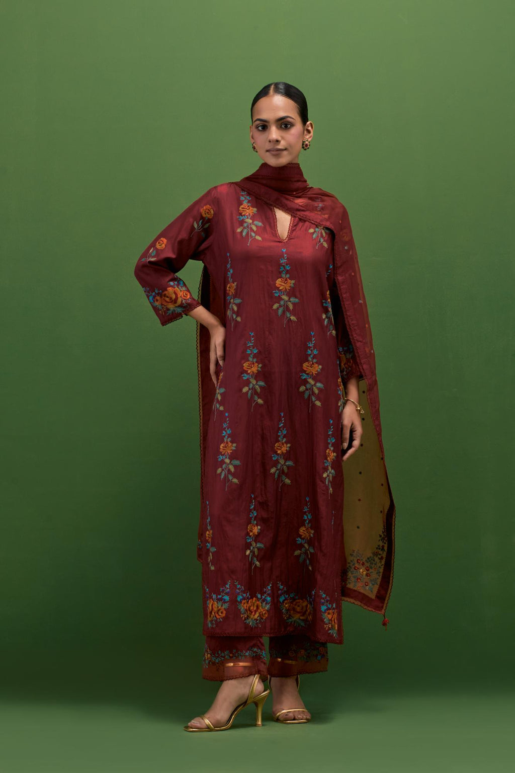 Rosewood silk straight kurta set with all-over rose embroidery and scalloped organza detail at the edges.