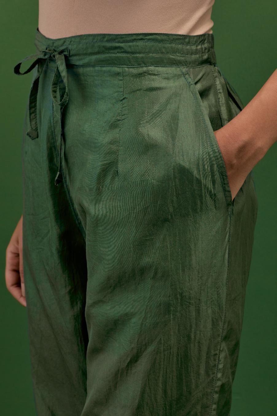 Brunswick green silk straight pants with a broad organza scalloped hem, hightlighted with hand-embroidred rose flower bunches and beads.