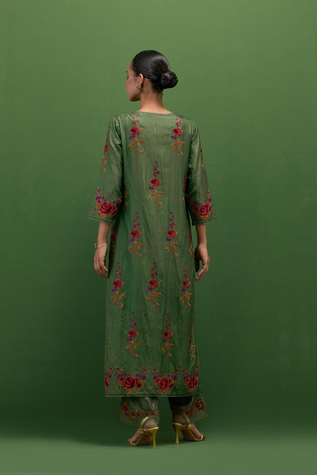 Brunswick green silk straight kurta set with all-over rose embroidery and scalloped organza detail at the edges.