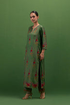 Brunswick green silk straight kurta set with all-over rose embroidery and scalloped organza detail at the edges.