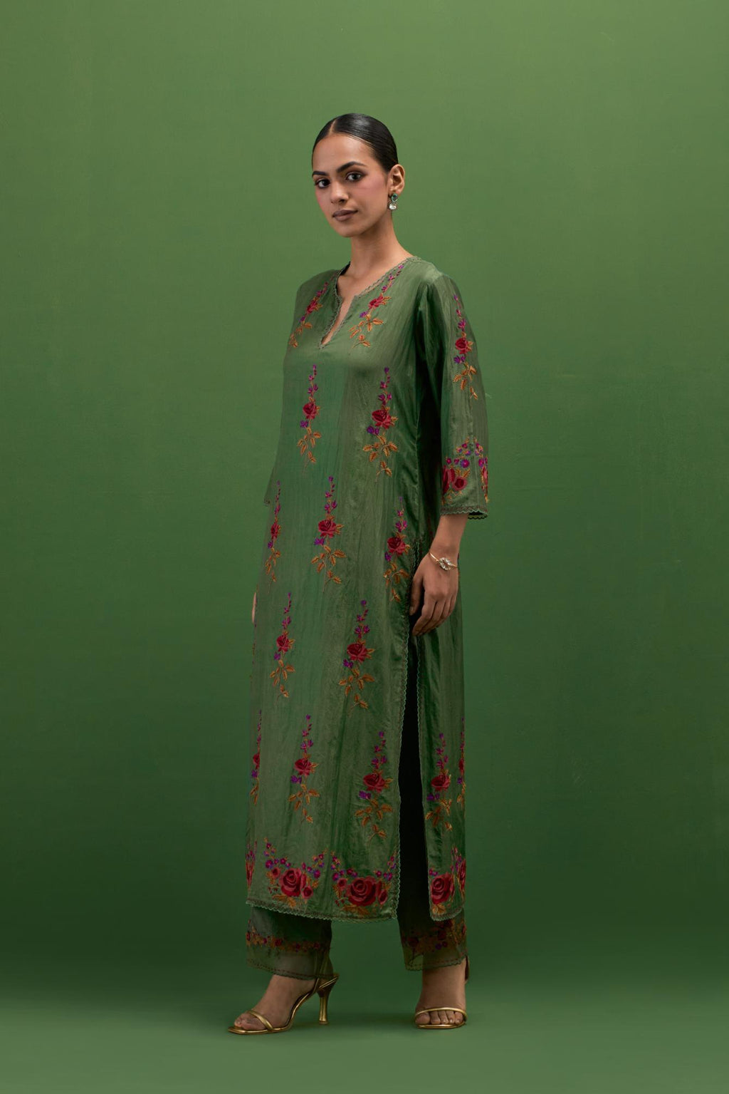 Brunswick green silk straight kurta set with all-over rose embroidery and scalloped organza detail at the edges.