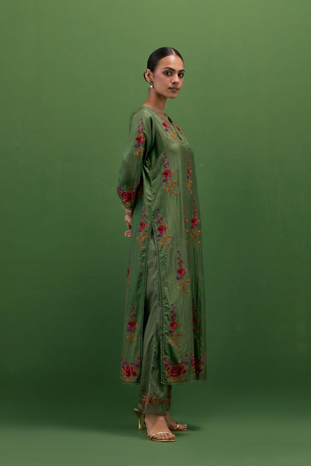 Brunswick green silk straight kurta set with all-over rose embroidery and scalloped organza detail at the edges.