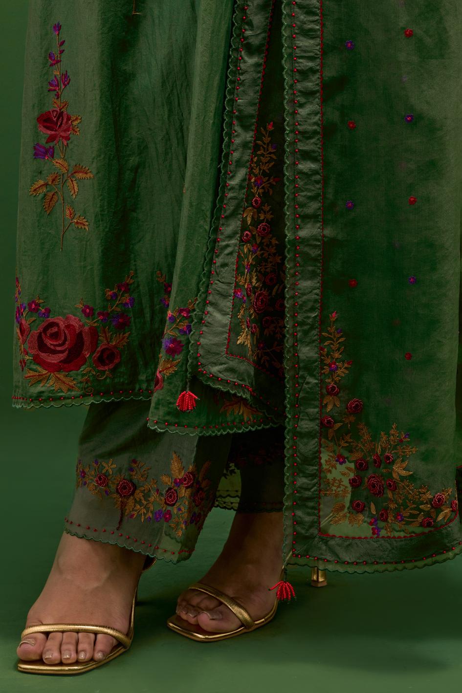 Brunswick green silk straight kurta set with all-over rose embroidery and scalloped organza detail at the edges.