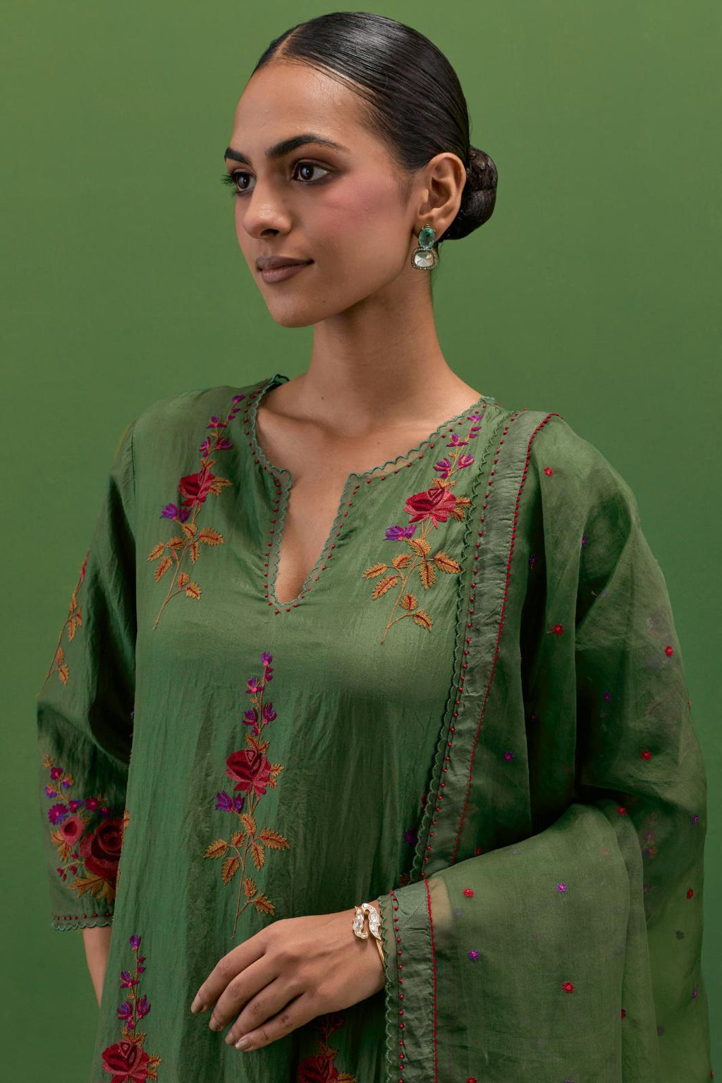 Brunswick green silk organza dupatta with a narrow silk border finished with a delicate organza scalloped edge, highlighted with contrast bead work.