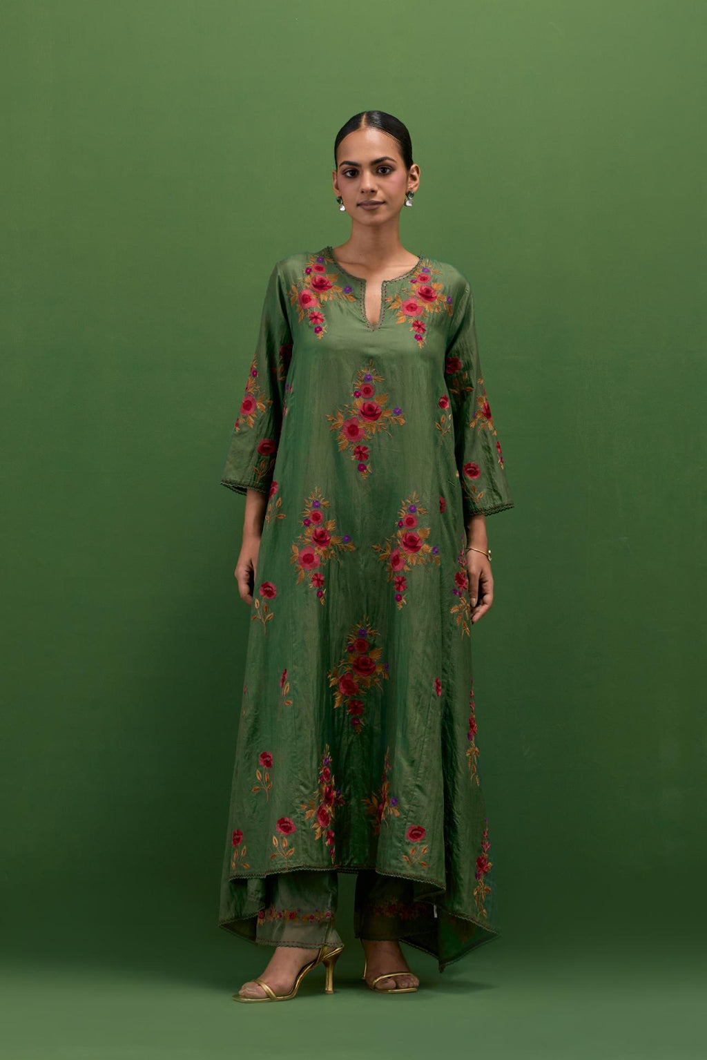 Brunswick green silk easy fit, asymmetric hem, panelled kurta set with all-over thread embroidered roses, highlighted with scalloped organza at the edges with contrast beads.