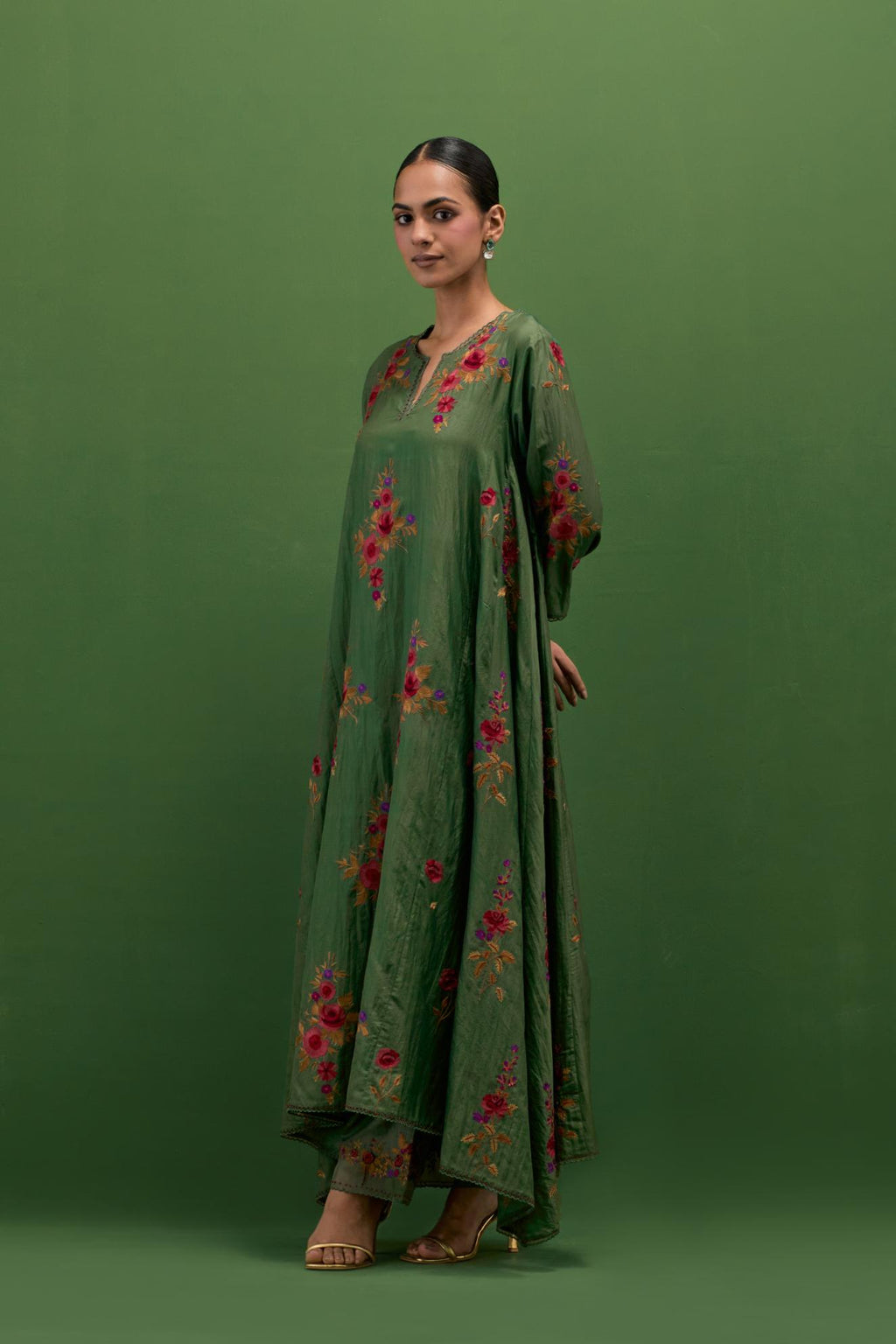 Brunswick green silk easy fit, asymmetric hem, panelled kurta set with all-over thread embroidered roses, highlighted with scalloped organza at the edges with contrast beads.