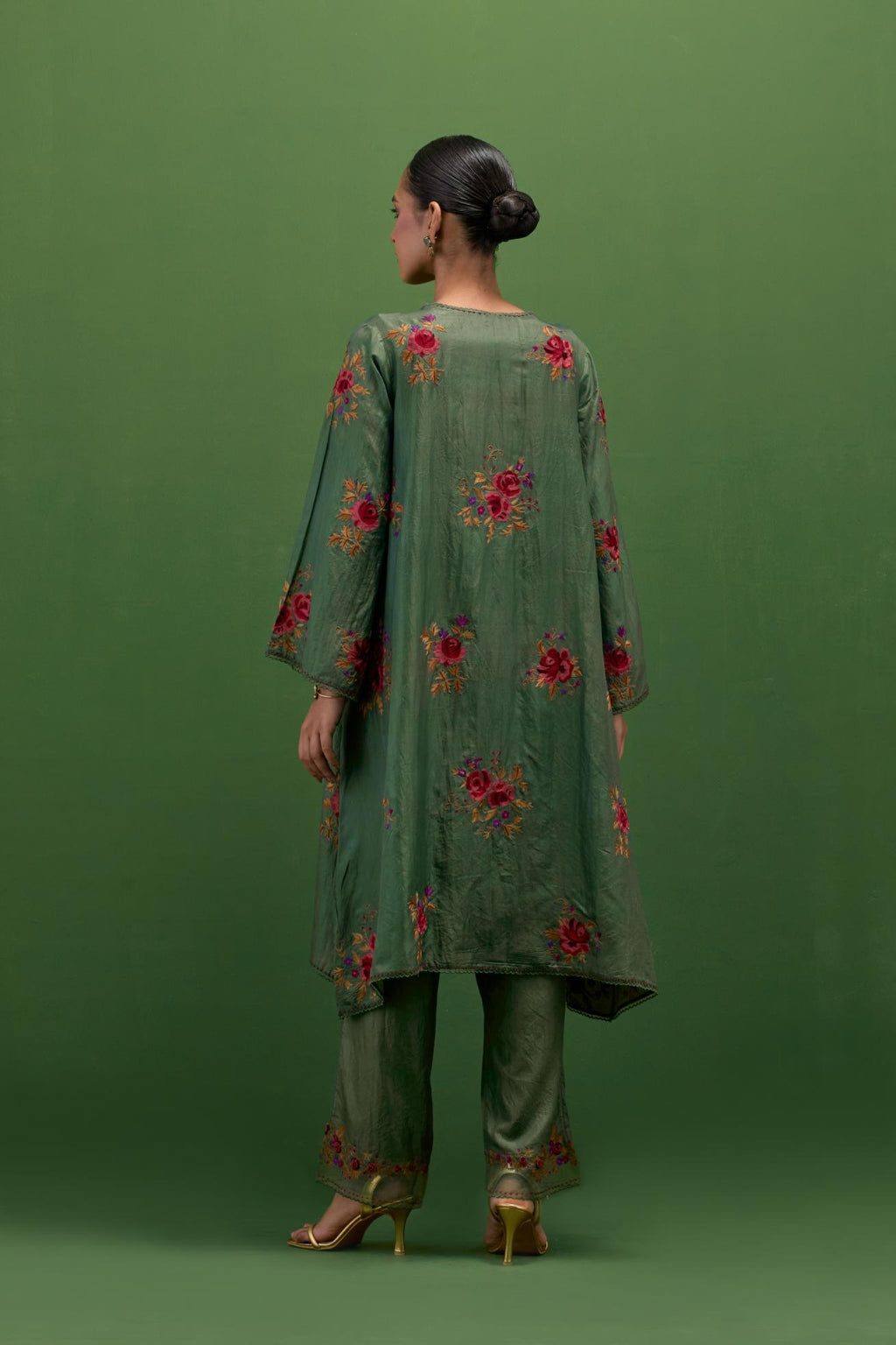 Brunswick green silk A-line short kurta set, with thread embroidery roses all over.