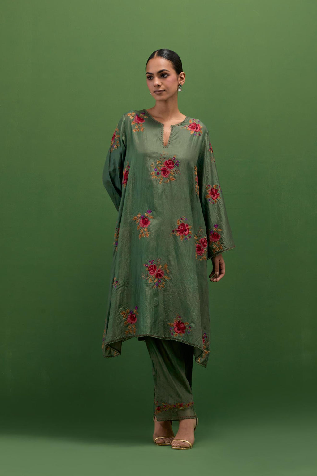 Brunswick green silk A-line short kurta set, with thread embroidery roses all over.