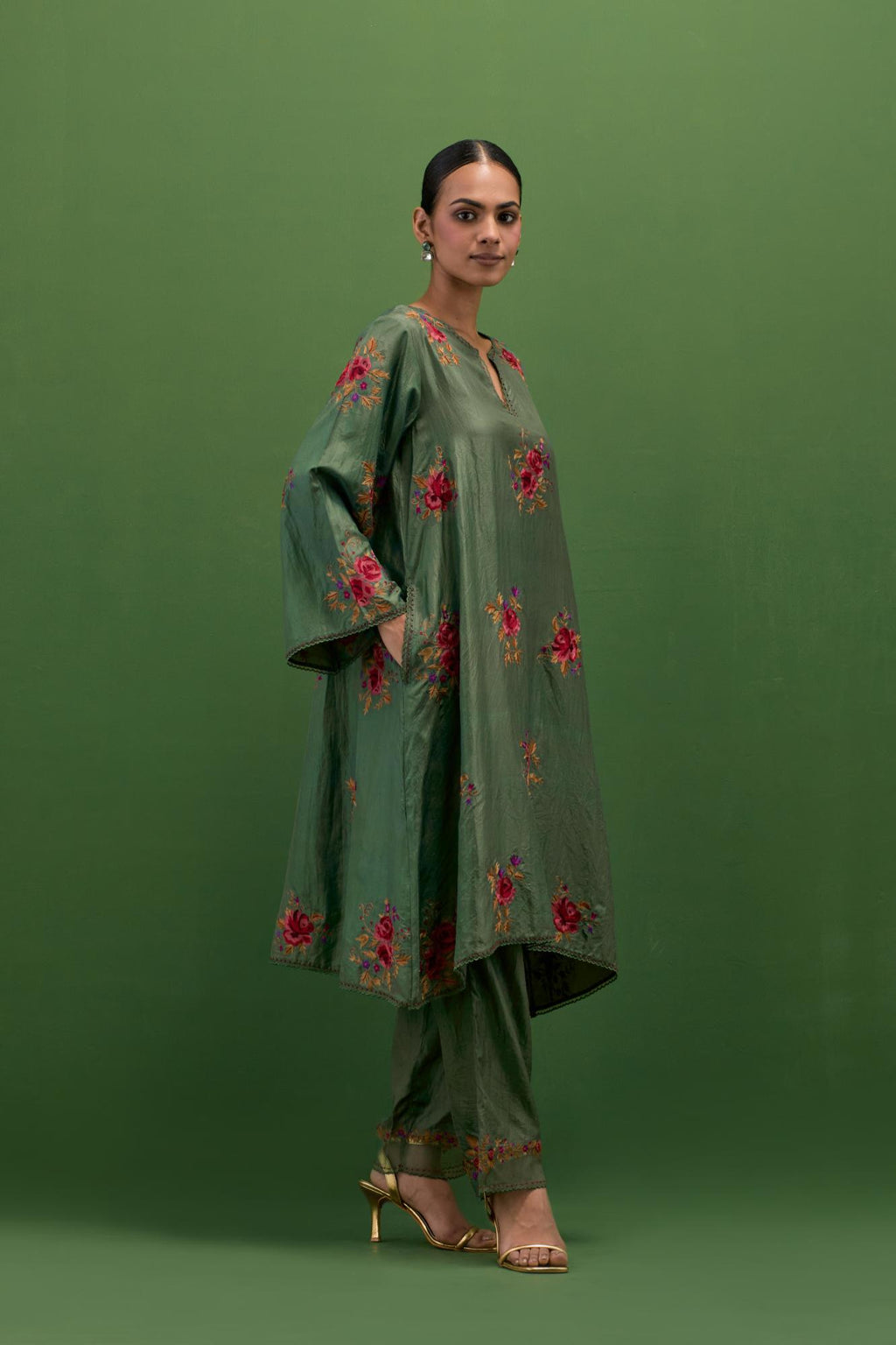 Brunswick green silk A-line short kurta set, with thread embroidery roses all over.