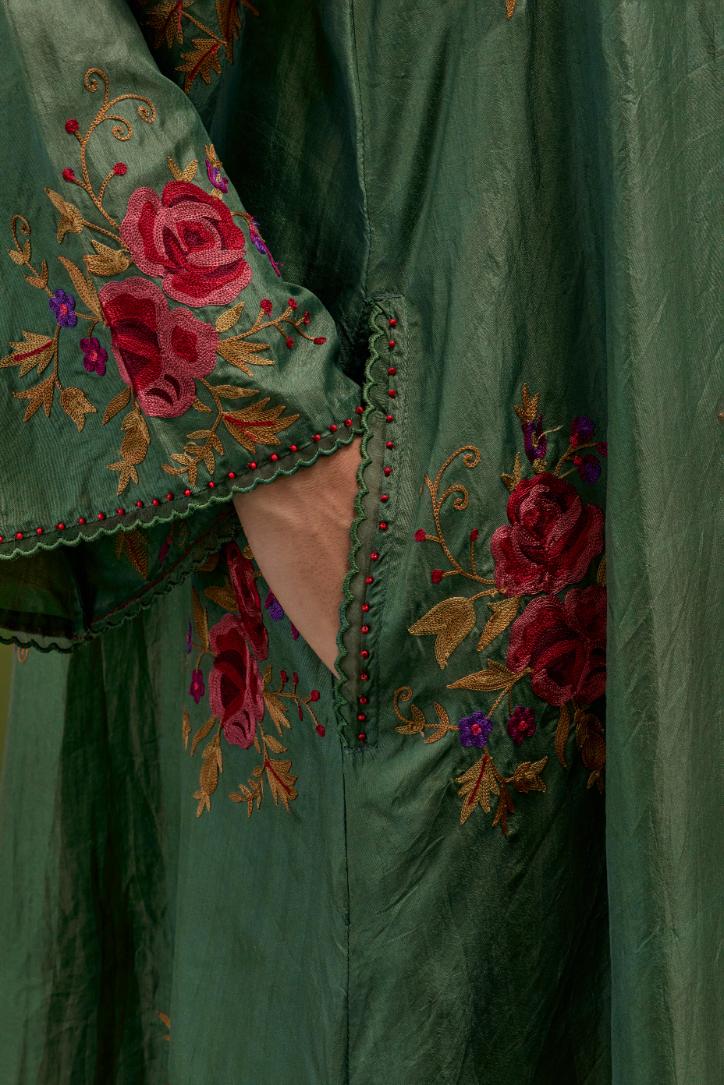 Brunswick green silk A-line short kurta set, with thread embroidery roses all over.