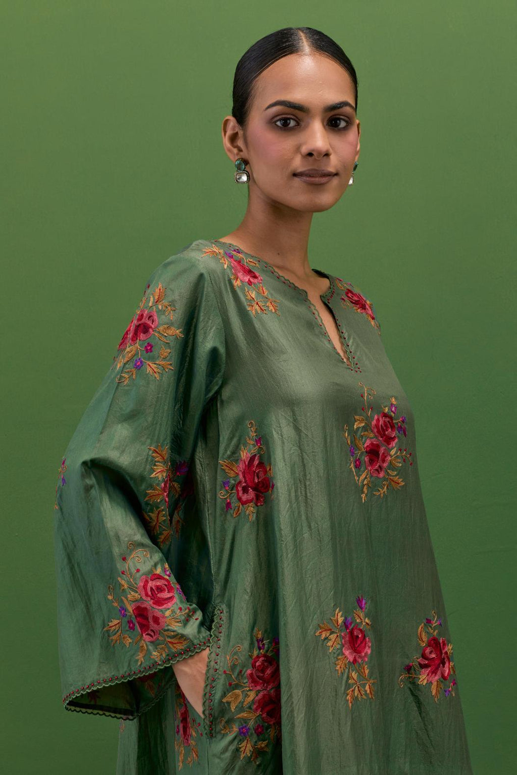 Brunswick green silk A-line short kurta set, with thread embroidery roses all over.