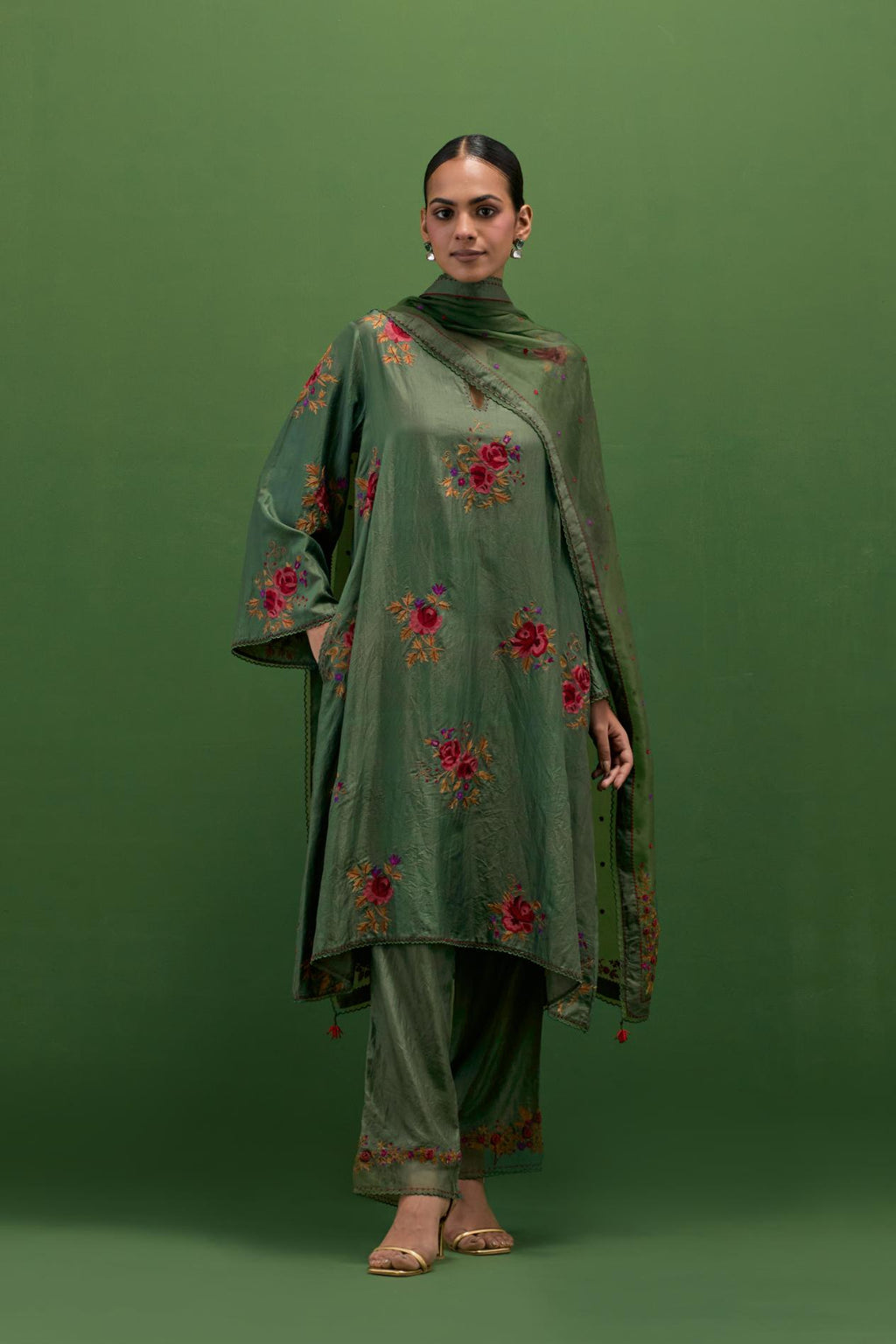 Brunswick green silk A-line short kurta set, with thread embroidery roses all over.