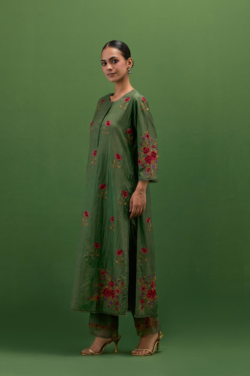 Brunswick green silk straight kurta set with all-over roses embroidered in thread and scalloped organza detail at the edges.