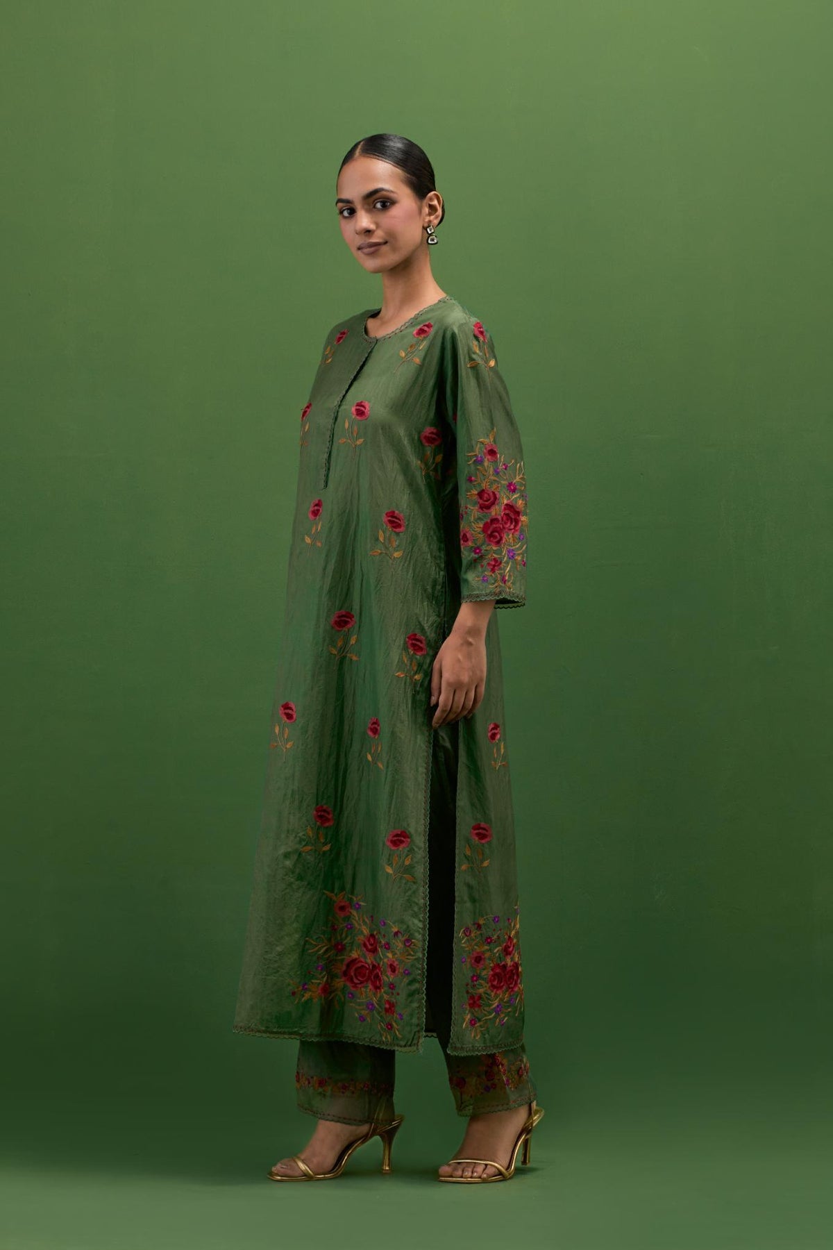 Brunswick green silk straight kurta set with all-over roses embroidered in thread and scalloped organza detail at the edges.