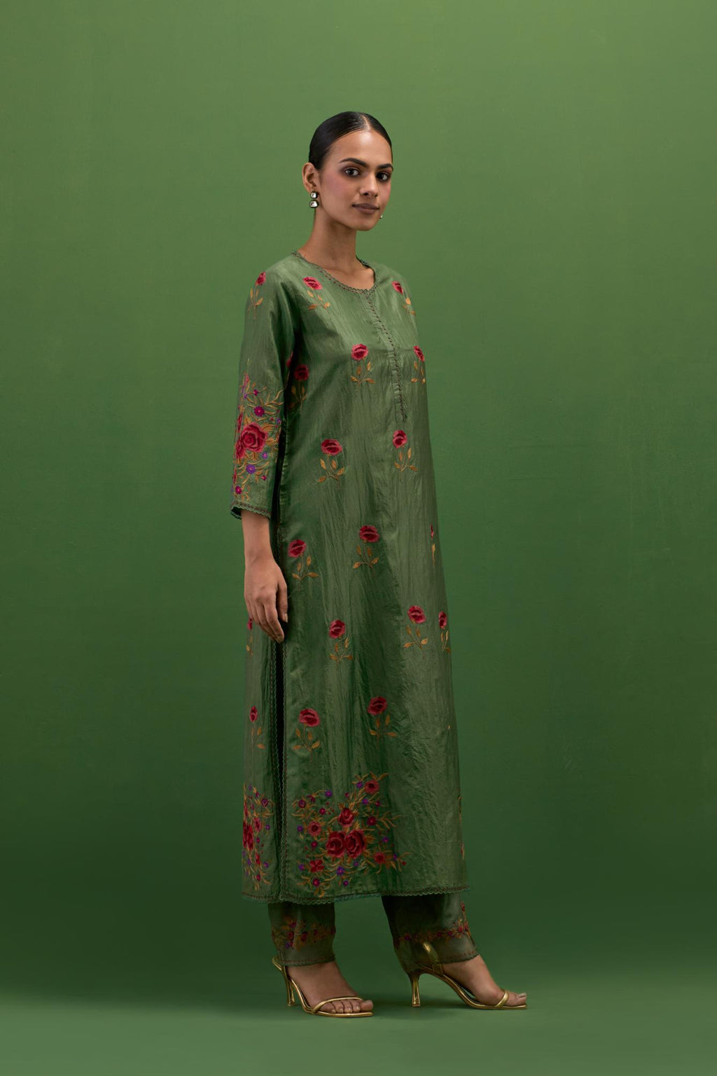Brunswick green silk straight kurta set with all-over roses embroidered in thread and scalloped organza detail at the edges.