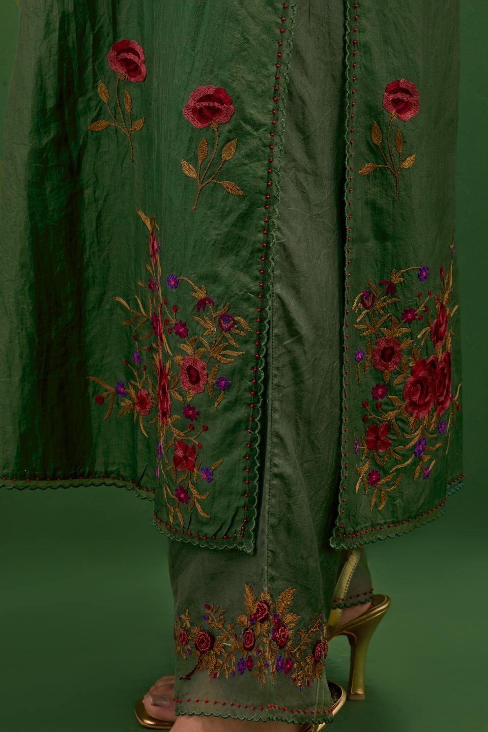 Brunswick green silk straight kurta set with all-over roses embroidered in thread and scalloped organza detail at the edges.