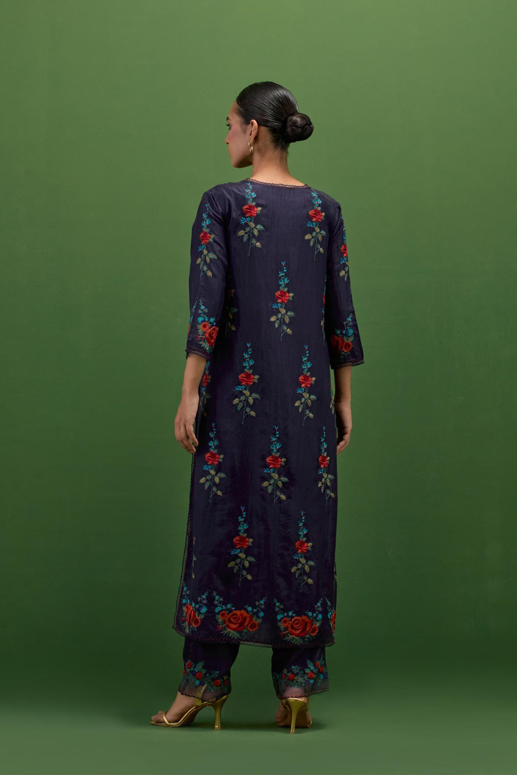 Midnight blue silk straight kurta set with all-over rose embroidery and scalloped organza detail at the edges.