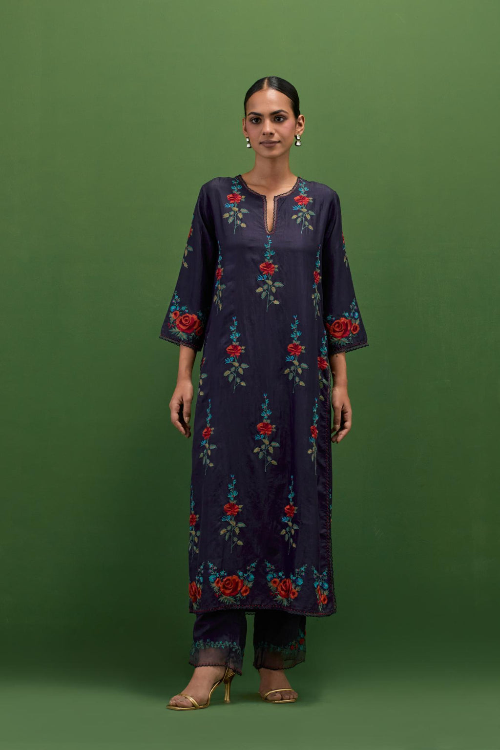 Midnight blue silk straight kurta set with all-over rose embroidery and scalloped organza detail at the edges.