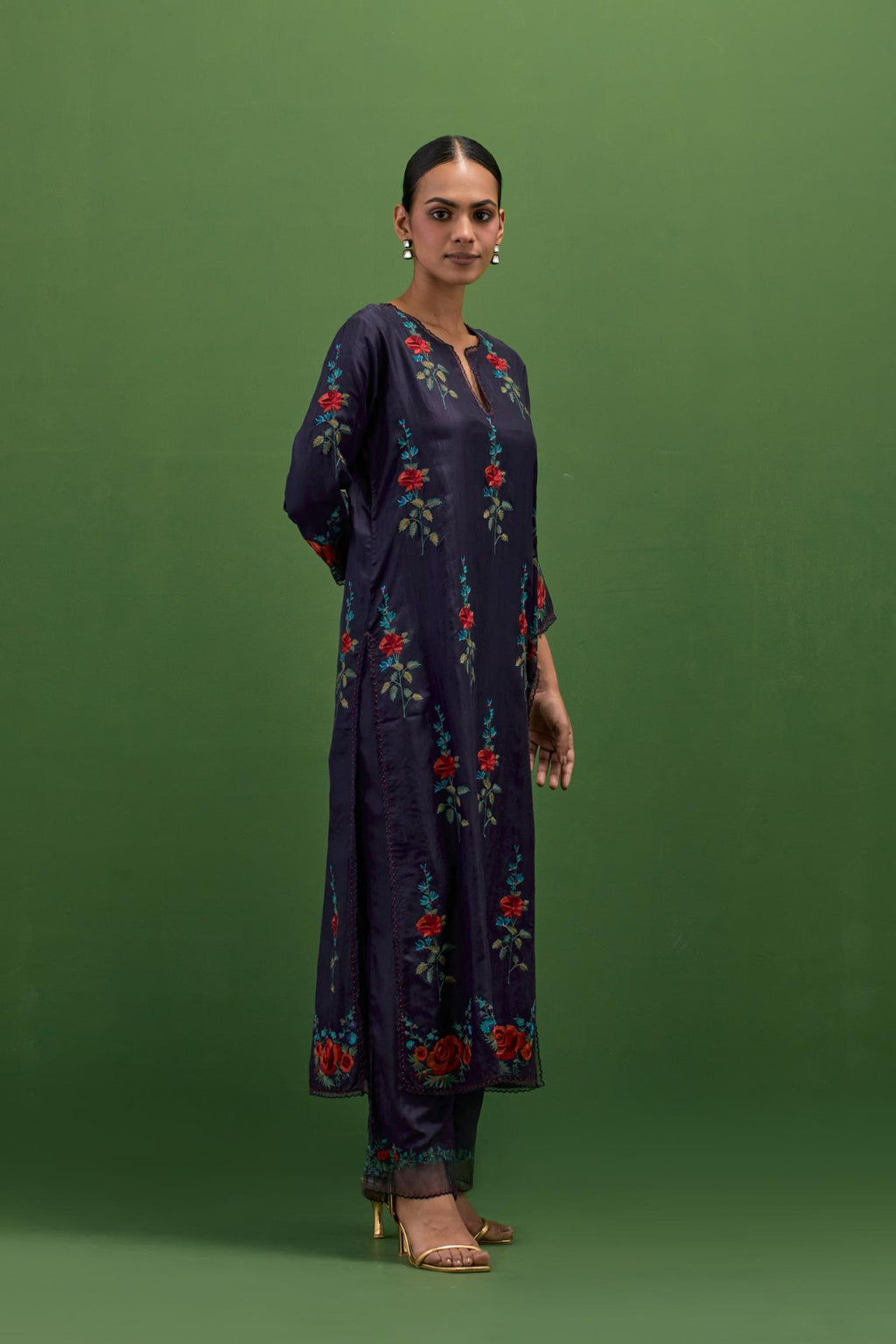 Midnight blue silk straight kurta set with all-over rose embroidery and scalloped organza detail at the edges.