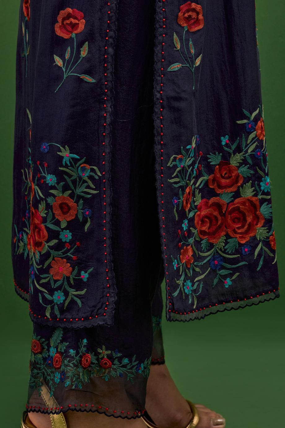 Midnight blue silk straight kurta set with all-over roses embroidered in thread and scalloped organza detail at the edges.