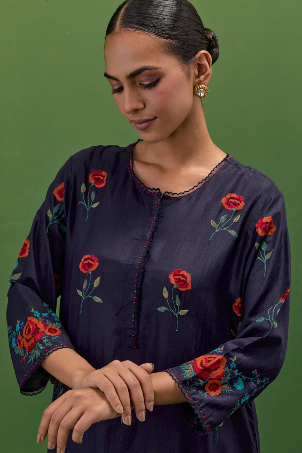 Midnight blue silk straight kurta set with all-over roses embroidered in thread and scalloped organza detail at the edges.