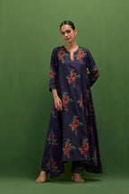 Midnight blue silk easy fit, asymmetric hem, panelled kurta set with all-over thread embroidered roses, highlighted with scalloped organza at the edges with contrast beads.