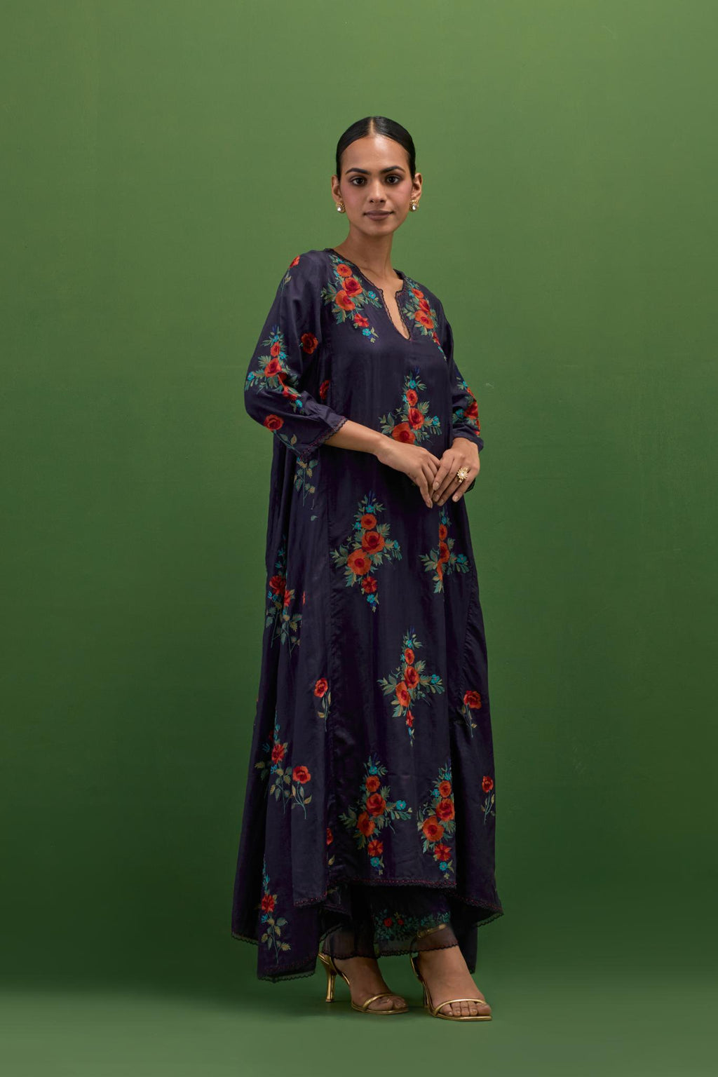 Midnight blue silk easy fit, asymmetric hem, panelled kurta set with all-over thread embroidered roses, highlighted with scalloped organza at the edges with contrast beads.