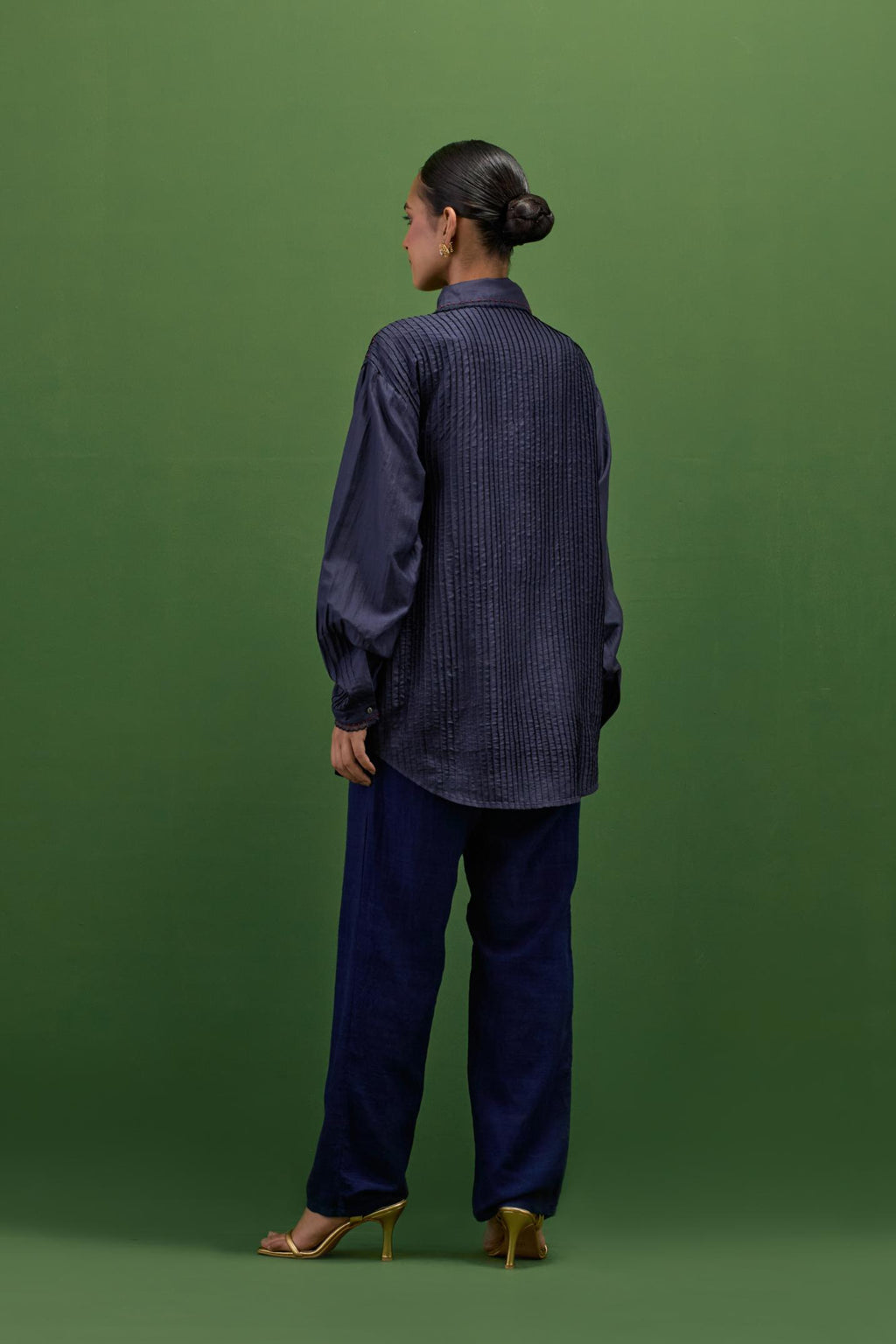 midnigh blue silk shirt with all-over pin tucks, highlighted with contrast beads in the front.