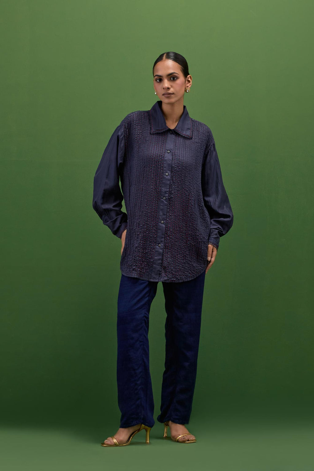 midnigh blue silk shirt with all-over pin tucks, highlighted with contrast beads in the front.