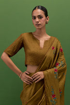 Golden olive silk blouse with all-over pin tucks, highlighted with bead work.